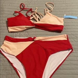 Red and pink two piece swim suit. Brand new. High waist bottom. Padded top.